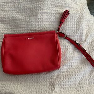 Coach coral colored wristlet